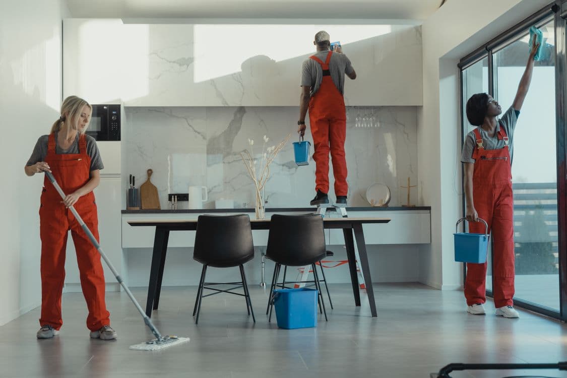Cleaning team thoroughly cleaning a dining room in a Paphos property